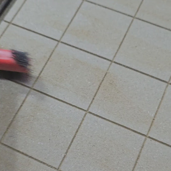 Brushing out dust from CNC carving grid lines